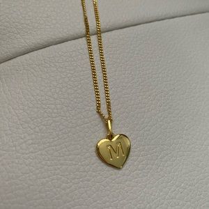 Gold initial letter “M” necklace